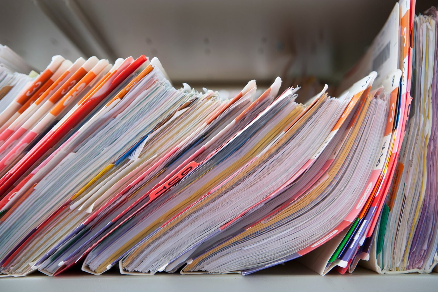 Overflowing paper patient files